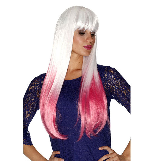 Model wearing a long, pink and white ombré wig with bangs.
