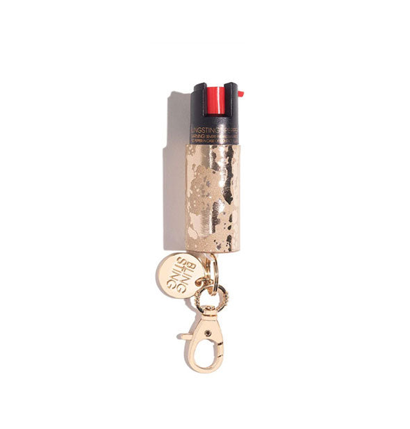 Gold cowhide-patterned Blingsting pepper spray canister with lobster clasp