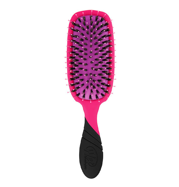 Pink and black hairbrush with purple paddle