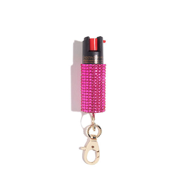 Hot pink rhinestone-encrusted pepper spray canister with rose gold lobster clasp attached