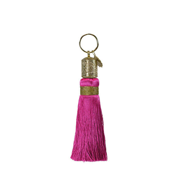 Fuchsia tassel keychain with decorative gold hardware