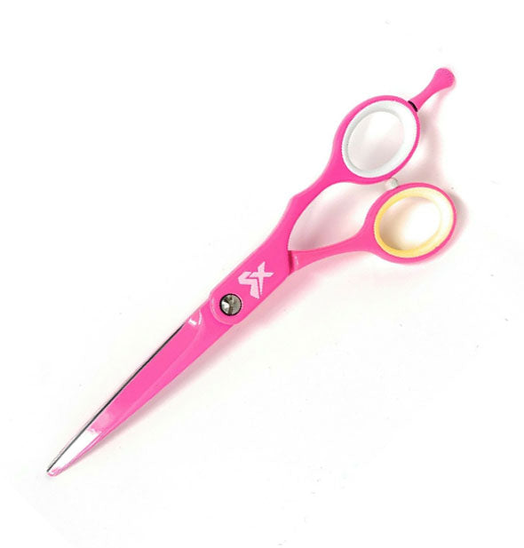 Pair of hot pink cutting shears with white and yellow finger holes