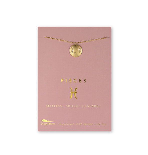 Gold Pisces necklace on card with metallic gold print and symbol