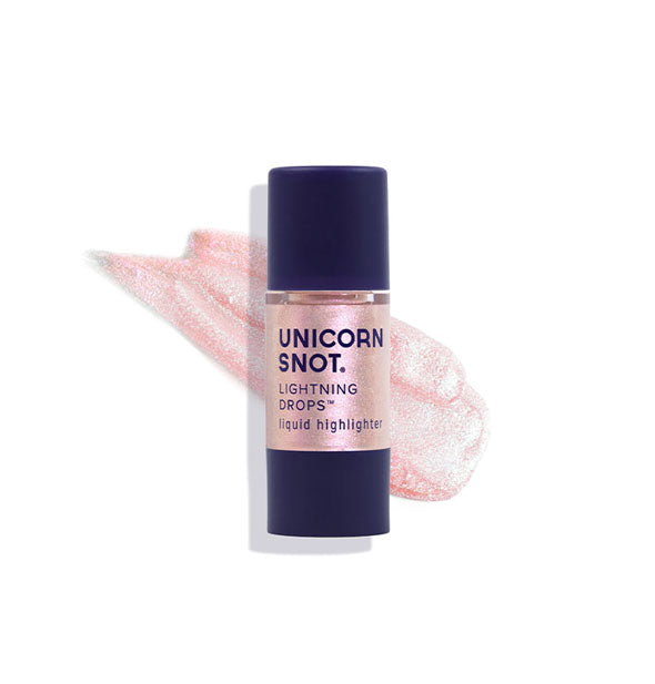 Bottle of Unicorn Snot Lightning Drops Liquid Highlighter in the shade Pixie with sample application