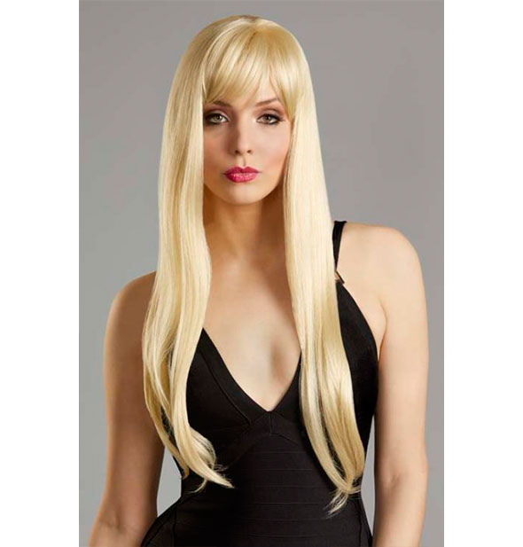 Model wearing a long, blonde wig with bangs.