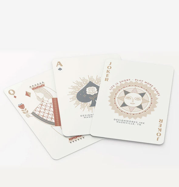 Spread of playing cards featuring decorative design