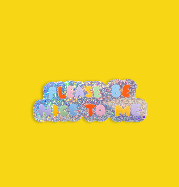 Sticker with holographic glitter background says, "Please Be Nice to Me" in colorful bubble lettering