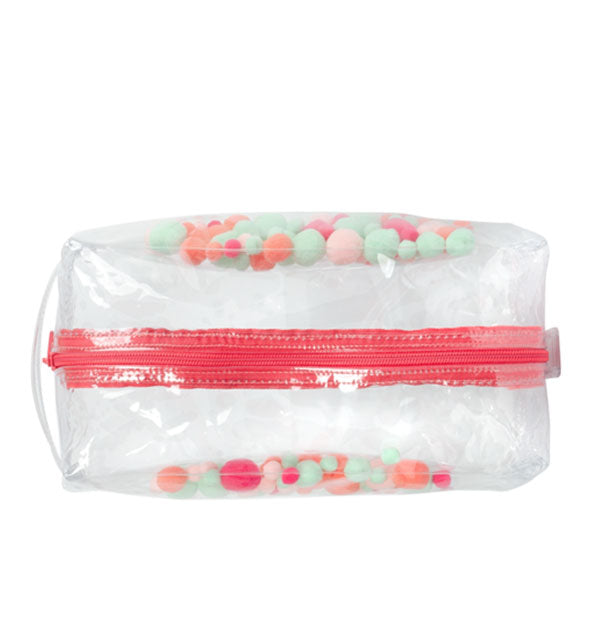 Top view of clear vinyl pouch with embedded multicolored pom poms and red zipper shown