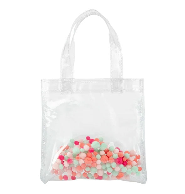 Clear vinyl tote bag with colorful pom poms enclosed in the material