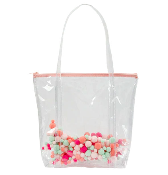 Clear vinyl tote bag with colorful pom poms enclosed in the material and a pink top zipper