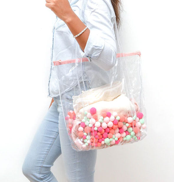 Model wears Pom Pom tote bag over shoulder
