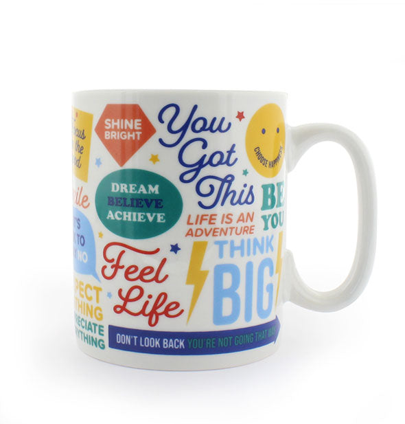 White ceramic mug printed with positive sayings and colorful graphics