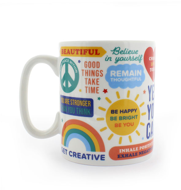 White ceramic mug printed with positive sayings and colorful graphics