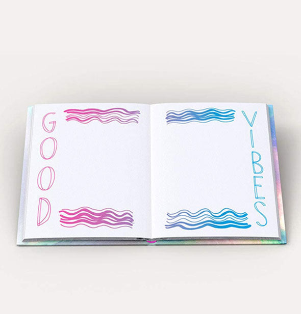 Posi Vibes journal interior says, "Good" on the left page in pink and "Vibes" on the right page in blue with wavy lines accenting each