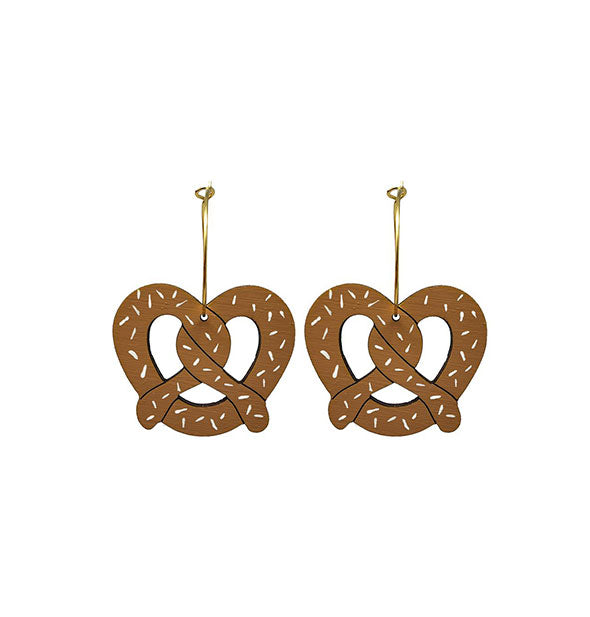 Pair of pretzel-shaped earrings on gold hoop rings