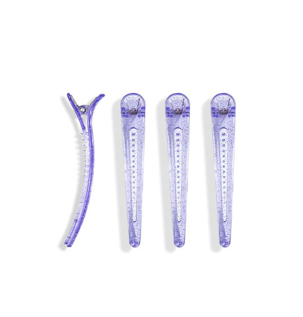 Four purple glitter hair clips