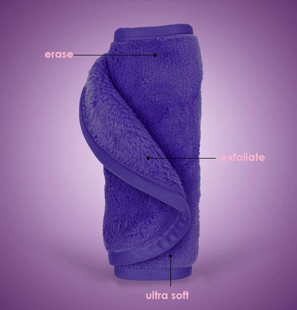 Rolled up purple MakeUp Eraser cloth is labeled, Erase, Exfoliate, Ultra Soft