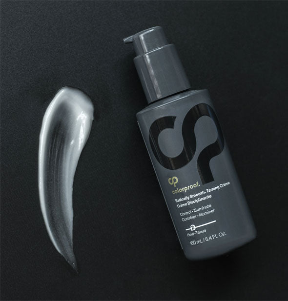 Bottle of ColorProof Radically Smooth Taming Crème next to a sample application of product