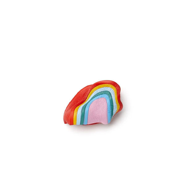 Small, colorful foam rainbow-shaped squeeze toy shown collapsed