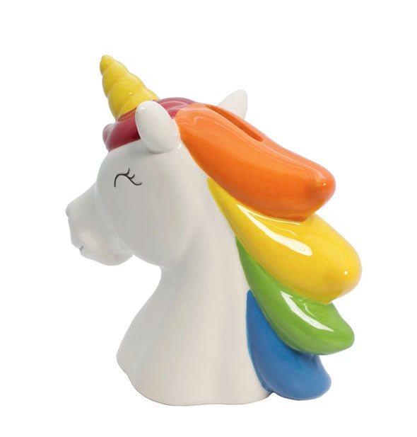 Rear view of a painted ceramic unicorn shows detail of its mane with a slot in the top to insert coins.