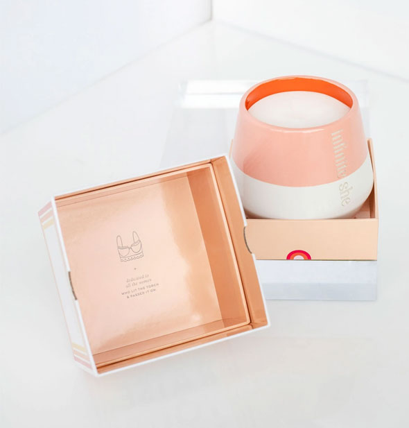 Infinite She candle with inside of box shown