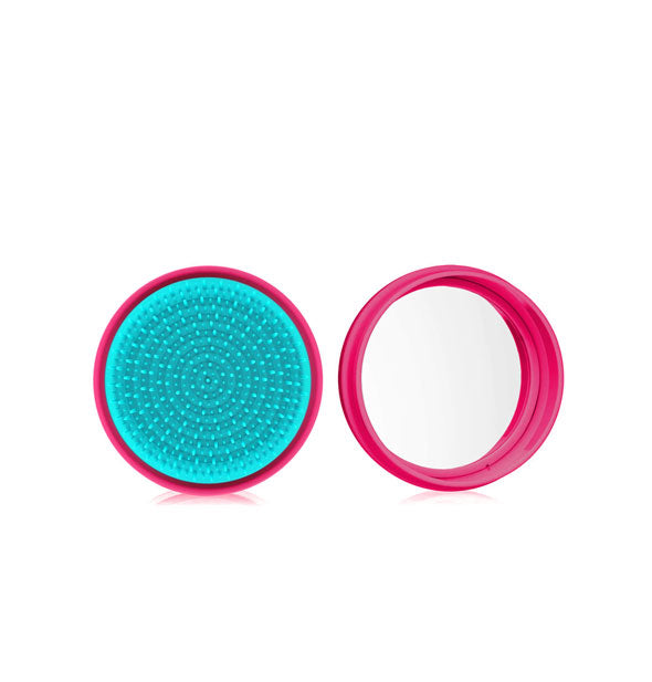 Round raspberry and turquoise macaron-shaped hairbrush shown open to reveal compact mirror inside
