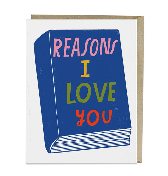 White greeting card with illustration of a thick book that says, "Reasons I Love You" on the cover in colorful lettering