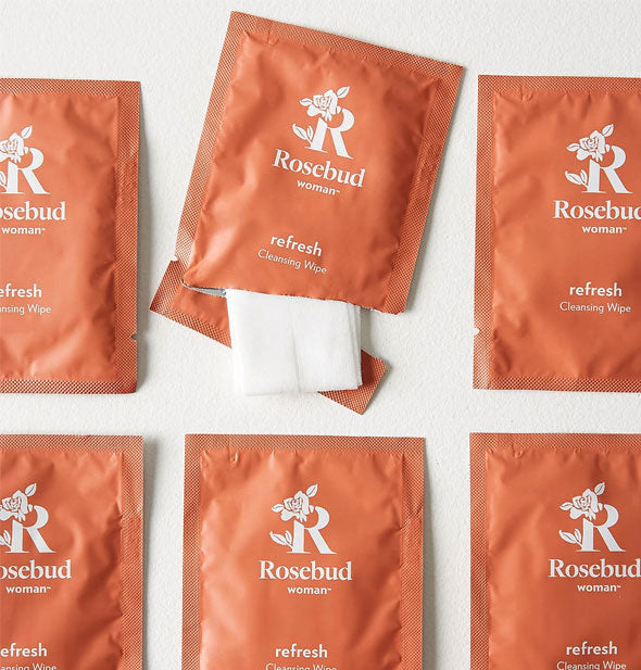 Packets of Rosebud Woman Refresh Cleansing wipes with one partially opened