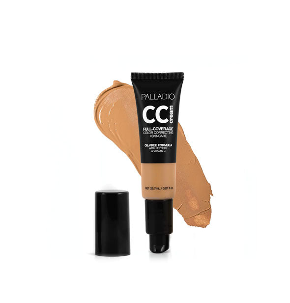 Tube of Palladio CC Cream Full-Coverage Color Correcting +Skincare in a medium-dark warm shade with cap removed sample swatch behind
