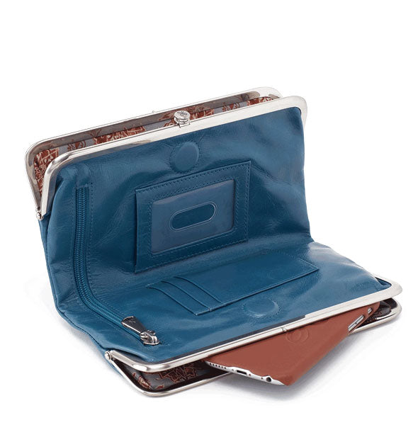 Opened blue leather wallet with phone emerging from one pocket reveals slots and zippered pocket inside