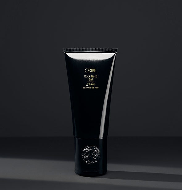Black bottle of Oribe Rock Hard Gel on a black background