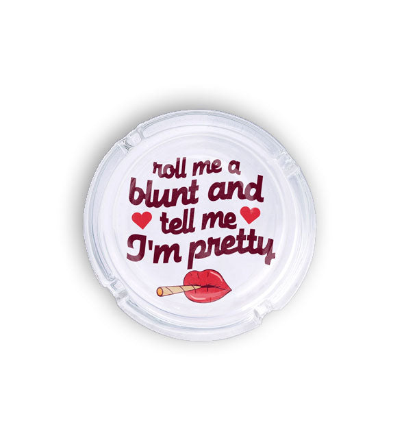 Round glass ashtray says, "Roll me a blunt and tell me I'm pretty" in red lettering with smoking lips and hearts graphics