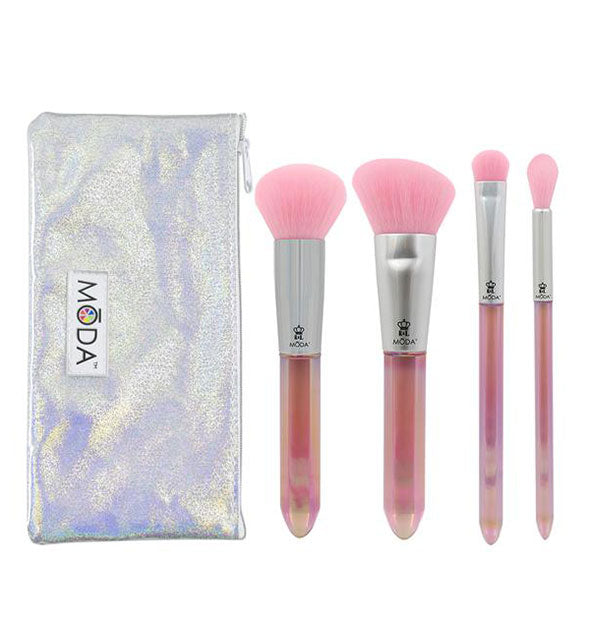 Set of four makeup brushes with pink bristles and crystal-shaped handles next to an iridescent storage pouch