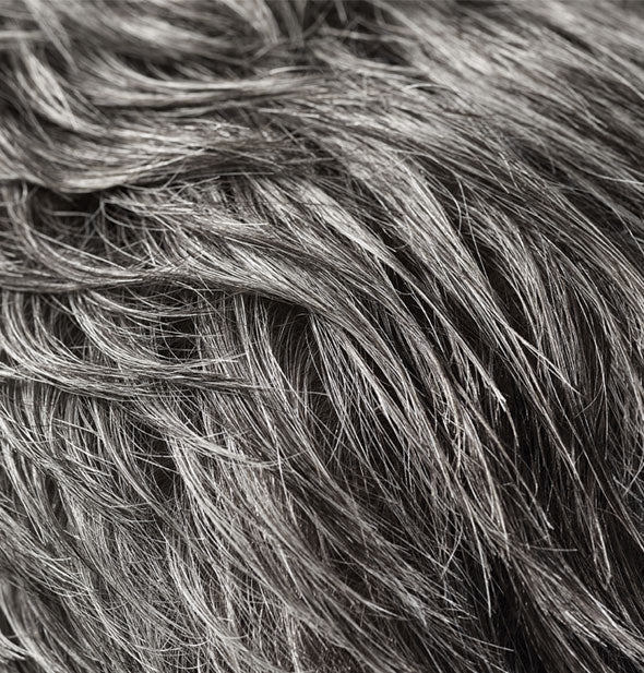 Closeup of hair styled with Oribe Rough Luxury Soft Molding Paste