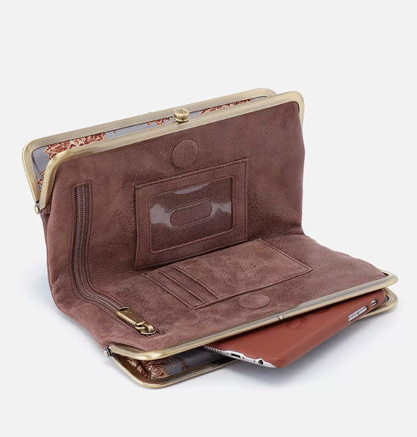 Brown leather wallet shown opened to reveal inside storage pockets