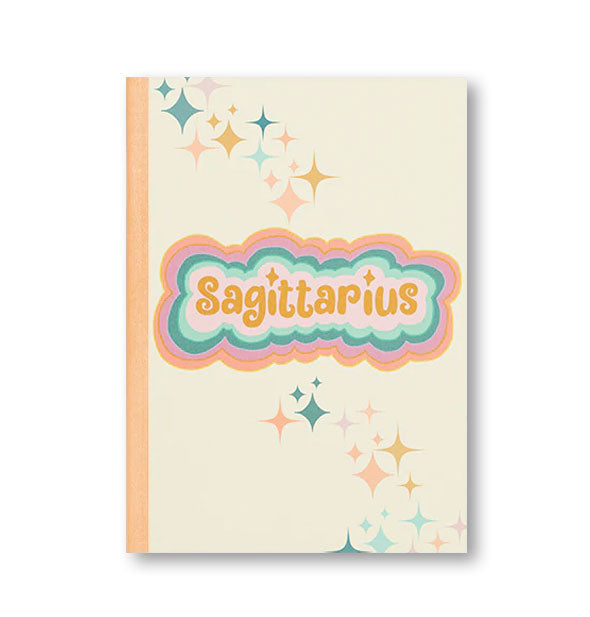 Notebook cover with peach binding, colorful stars, and colorful radiant lettering that reads, "Sagittarius"