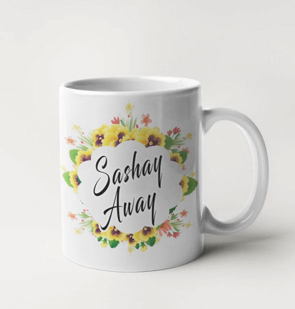 White coffee mug with floral design says, "Sashay Away" in black script