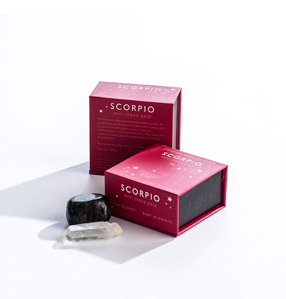 Two fuchsia Scorpio Mini Stone Packs with crystals displayed in front.