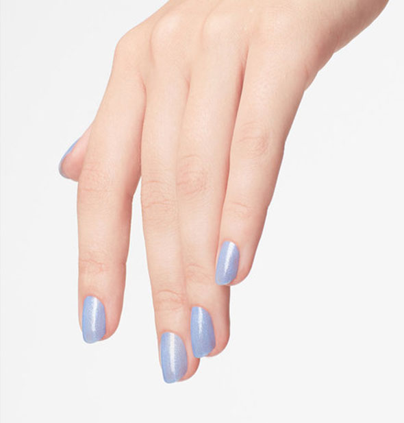 Model's hand wears a periwinkle shade of nail polish