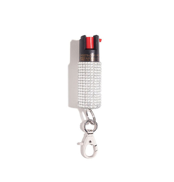 Silvery white rhinestone-encrusted pepper spray canister with rose gold lobster clasp attached