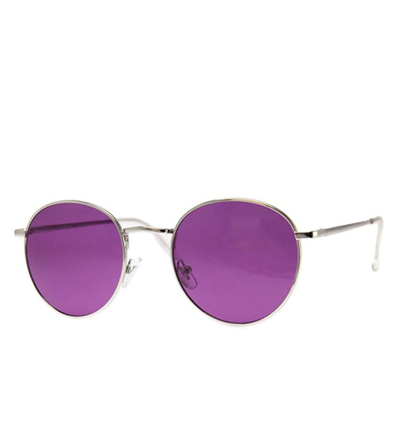 Sunglasses with a rounded metal frame and purple lenses