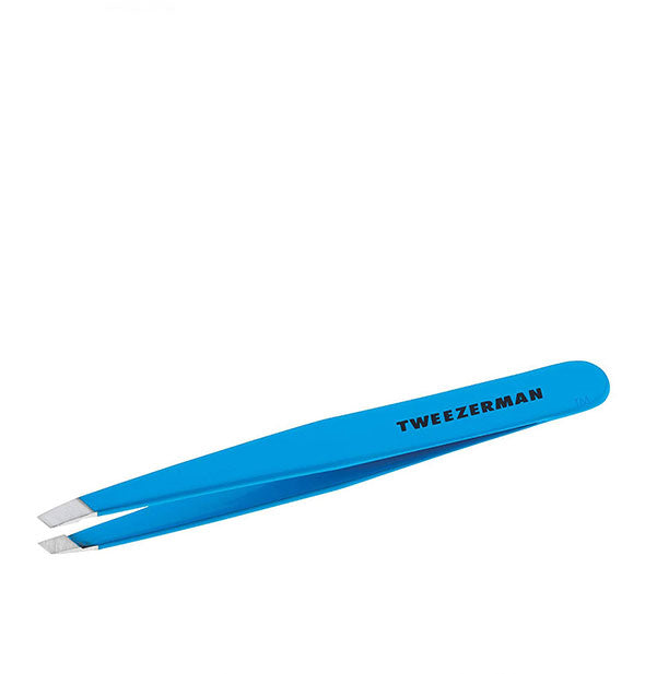 Blue tweezer with black Tweezerman logo on the handle and slanted stainless steel tips