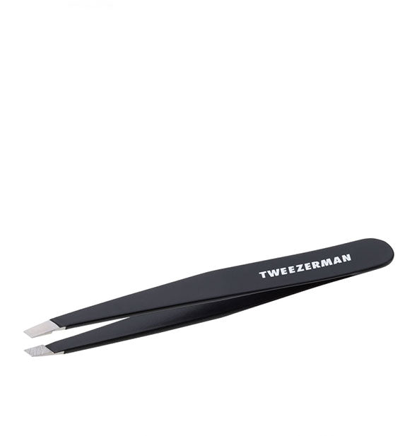 Black tweezer with white Tweezerman logo and slanted stainless steel tips