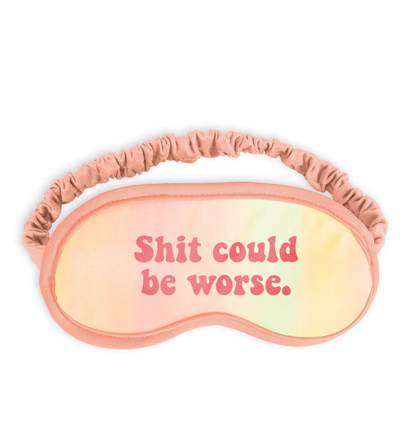Blush pink eye mask with ruched elastic band says, "Shit could be worse."