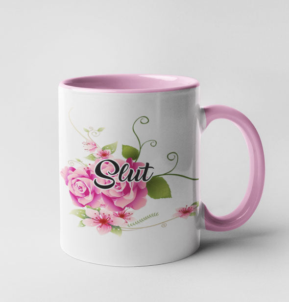 White "Slut" coffee mug with pink details, pink floral graphic, and black script