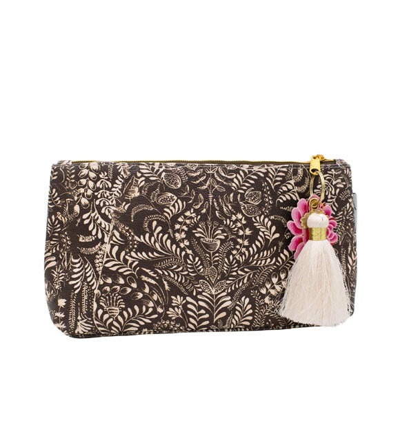 Small pouch with intricate white floral brushstroke design and white tassel hanging from a gold zipper