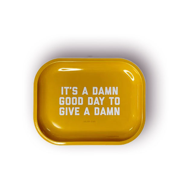 Small rectangular yellow tray with rounded corners says, "It's a damn good day to give a damn" in white lettering