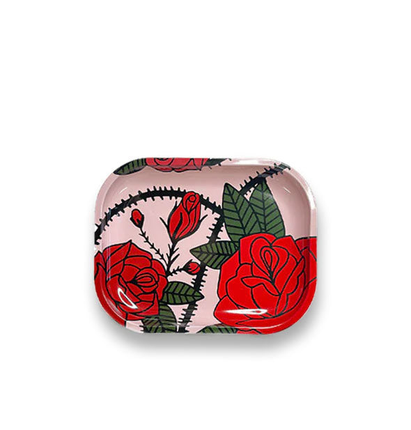 Rectangular light pink metal tray with rounded corners features an all-over red thorny roses design