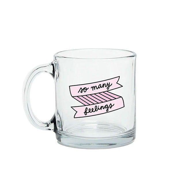 Clear glass mug says, "So many feelings" in black cursive inside a pink line-drawn banner design