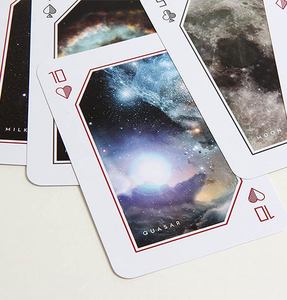 Sample cards from the Space Playing Cards deck feature celestial imagery